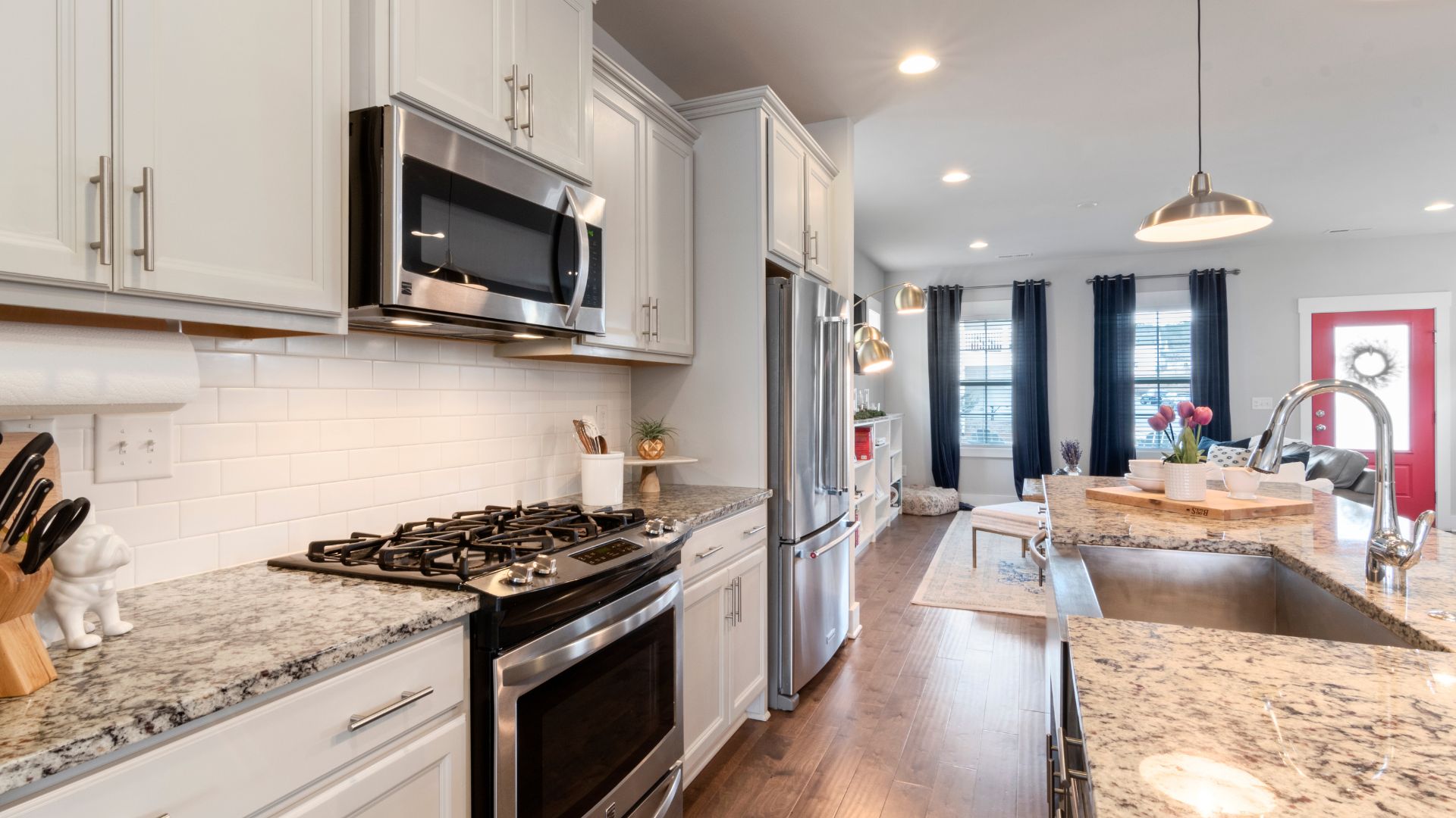 A kitchen with a stove top oven next to a counter